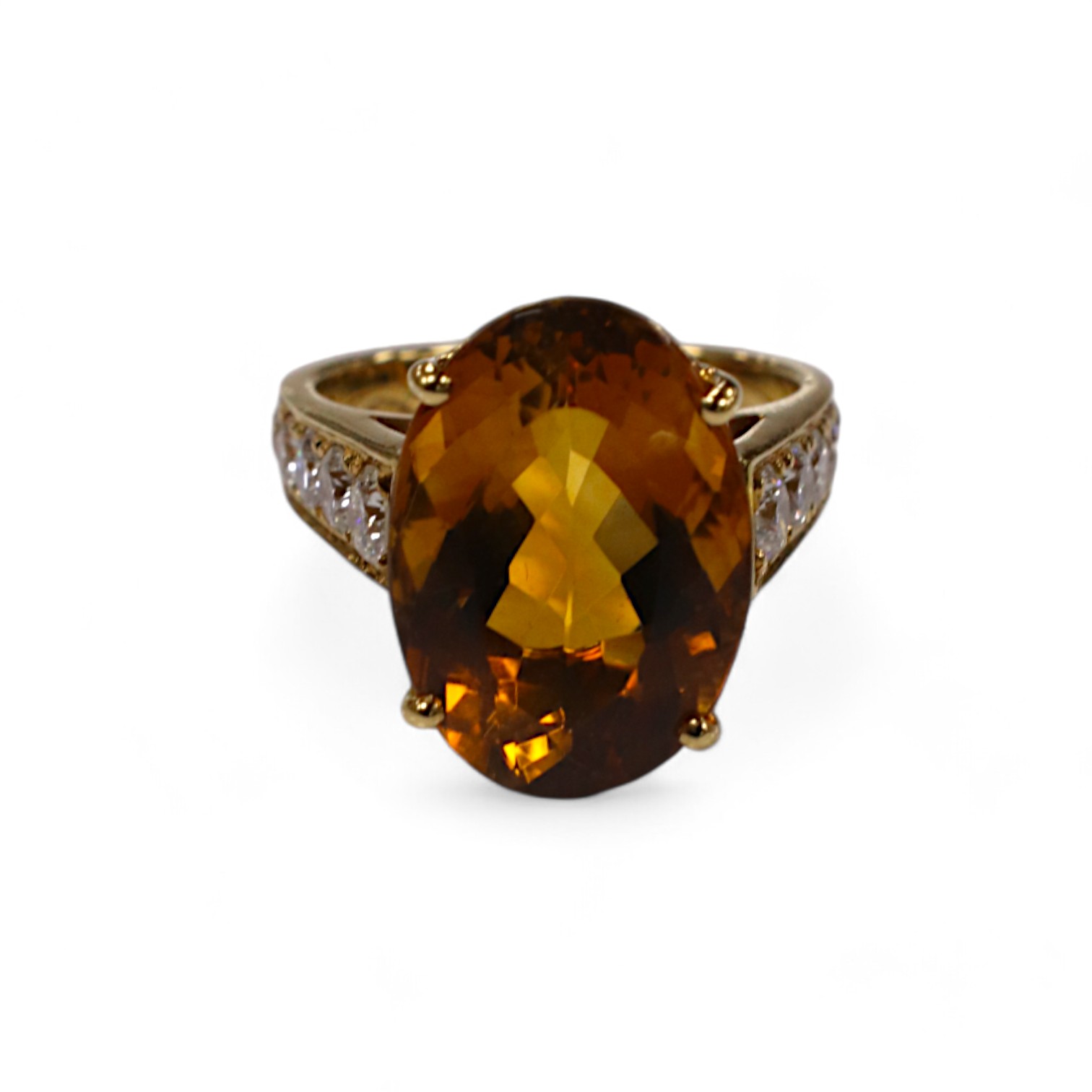 A modern 18k and single stone oval cut citrine set dress ring, with ten stone graduated diamond set shoulders, size K, gross weight 7,7 grams. Condition - good